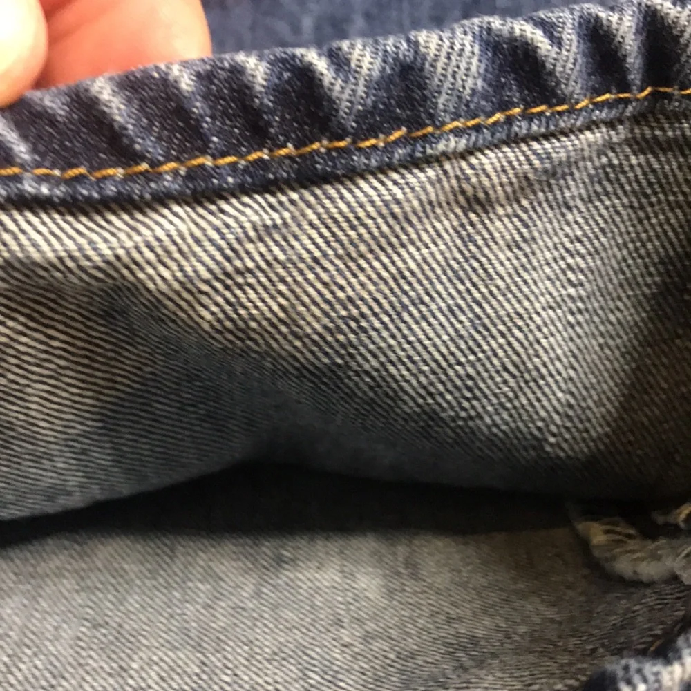 Levi’s 501 button fly Jeans size 35x28 (tag size 36x34) lightly distressed